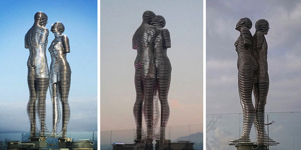 Moving Statues Of Man And Woman Passing Through Each Other Depict Tragic Love