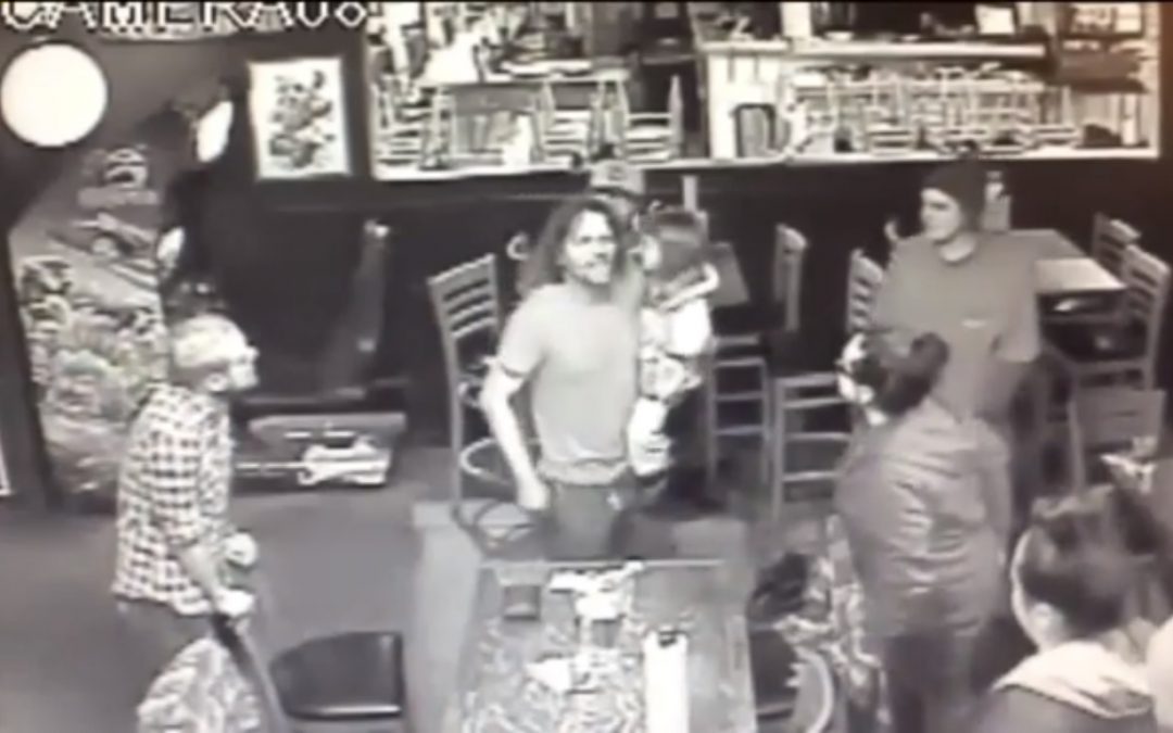 man starts bar fight holding four year old child